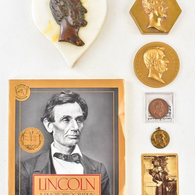 ABRAHAM LINCOLN MEMORABILIA: PAPERWEIGHTS, NECKLACE PENDANT, AND MORE