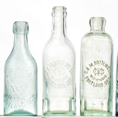 ASSORTMENT OF GLASS BOTTLES FROM PORTLAND, OREGON