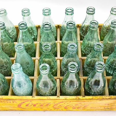 YELLOW COCA-COLA WOODEN CRATE WITH 24 GLASS BOTTLES