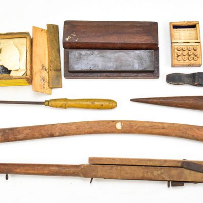ASSORTMENT OF ANTIQUE TOOLS: CARPET STRETCHER, WATCH CASE SCREWS, SHARPENING STONE & MORE