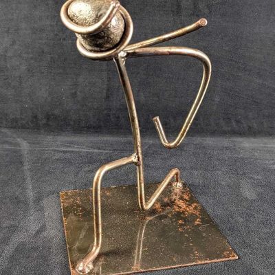 Sale Photo Thumbnail #241: Hand-Made Metal Abstract Bowing Man Sculpture