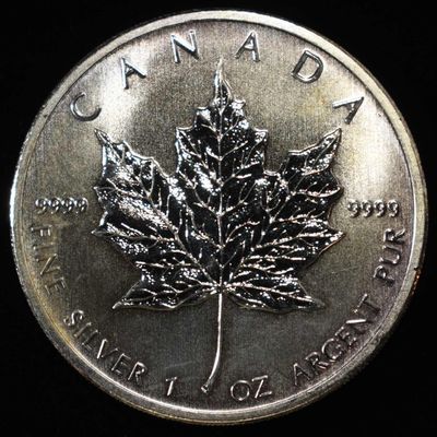 2011 MAPLE LEAF 1 OZ .999 SILVER ROUND
