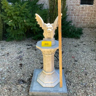 Sale Photo Thumbnail #9: Cast stone gargoyle statue perched on an octagonal pedestal, measuring approximately 34 inches tall overall.