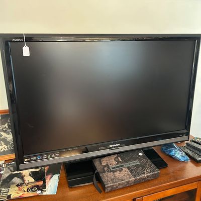 Sale Photo Thumbnail #86: 49" Sharp Flat Screen TV. 