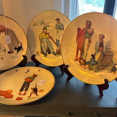 Sale Photo Thumbnail #17: Collection of vintage Norman Rockwell collector plates with gold rims.