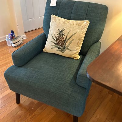 Sale Photo Thumbnail #36: Modern teal upholstered armchair with tapered wooden legs. 