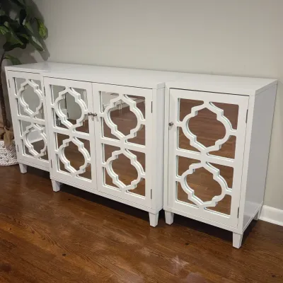 Sale Photo Thumbnail #44: Modern white three-piece sideboard credenza featuring mirrored glass cabinet doors with geometric quatrefoil overlays.