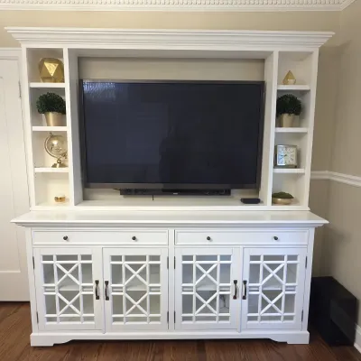 Sale Photo Thumbnail #113: Large contemporary white painted entertainment center with side shelving units, glass mullion cabinet doors, and built-in crown molding.