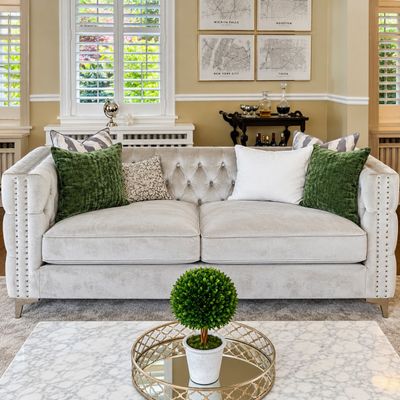 Sale Photo Thumbnail #8: Contemporary light gray velvet chesterfield sofa, featuring tufted details and nailhead trim.