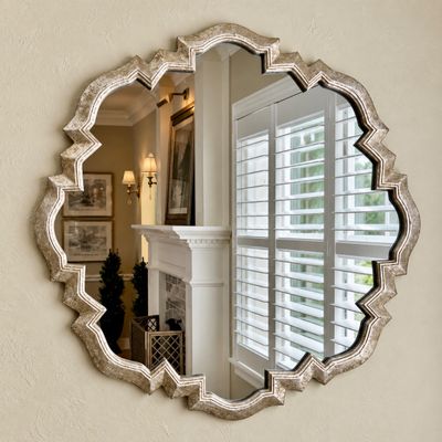 Sale Photo Thumbnail #3: Large decorative wall mirror featuring a scalloped quatrefoil frame with an antiqued silver-leaf finish.