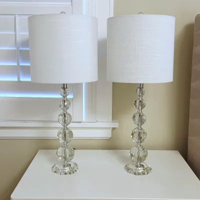 Sale Photo Thumbnail #75: Pair of modern stacked faceted glass globe table lamps with white drum shades.