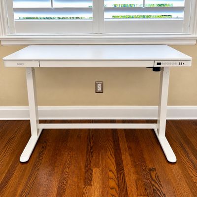 Sale Photo Thumbnail #108: FlexiSpot modern white electric height-adjustable standing desk featuring a built-in drawer, digital keypad, and integrated USB ports.