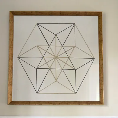 Sale Photo Thumbnail #127: Framed contemporary geometric line art in a square gold leaf frame.