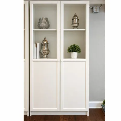 Sale Photo Thumbnail #81: Pair of modern white display cabinets featuring glass upper door panels, solid lower cabinet doors, and adjustable shelving.