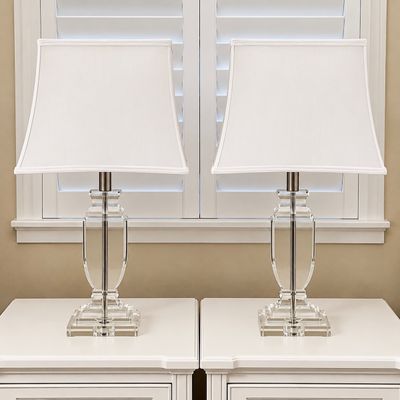 Sale Photo Thumbnail #88: Pair of contemporary clear crystal table lamps with brushed nickel hardware and matching white fabric shades.