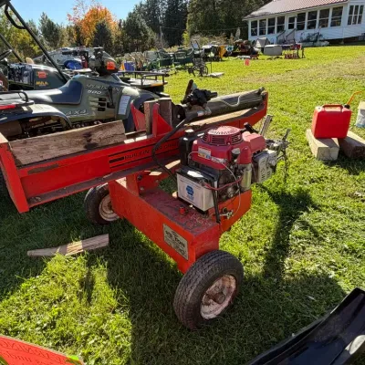 Sale Photo Thumbnail #14: Red gas-powered log splitter with a Honda engin
