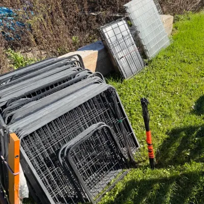 Sale Photo Thumbnail #22: A collection of folded wire dog crates and pet playpen panels 