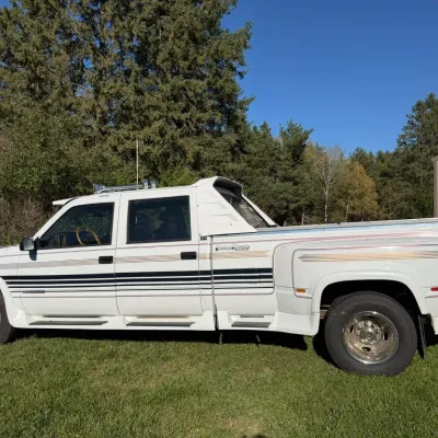Sale Photo Thumbnail #3: White GMC dually pickup truck with custom Classy Chassis