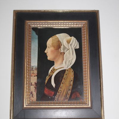 Sale Photo Thumbnail #38: Framed reproduction portrait of a Renaissance woman in profile, housed in a wide black and gold-toned wooden frame.