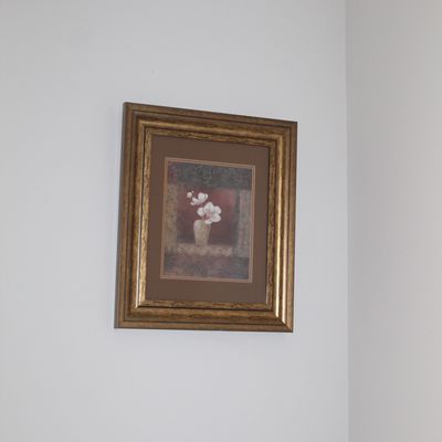 Sale Photo Thumbnail #28: Framed floral still life print depicting white flowers in a vase, presented in a brown mat and an ornate gold-finished frame.