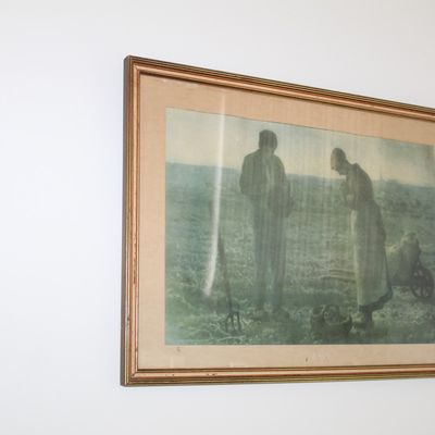 Sale Photo Thumbnail #75: Framed print of Jean-François Millet's "The Angelus," depicting two peasants bowing in prayer in a field, housed in a vintage gilt wood frame.