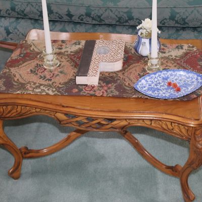 Sale Photo Thumbnail #72: Vintage French Provincial style wooden coffee table featuring carved cabriole legs, a cross-braced stretcher, and a decorative lattice apron.