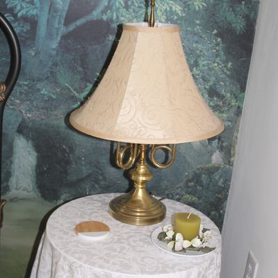 Sale Photo Thumbnail #49: Vintage brass table lamp featuring a French horn motif base and a beige bell shade with swirl embroidery.