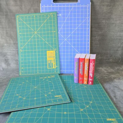 Olfa And June Taylor Cutting Mats And Collection Of 4 Sewing Related Answer Books