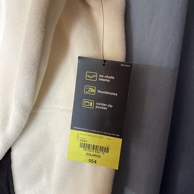 Sale Photo Thumbnail #429: New with tags Xersion quarter-zip fleece pullover in ivory with black trim and accent pocket. Features brushed interior fleece fabric, thumbholes, center zip pocket, and no-chafe seams. Size XXL.