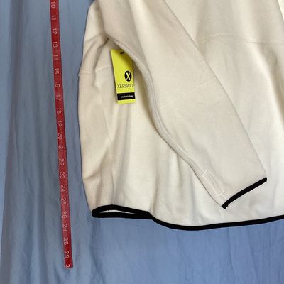 Sale Photo Thumbnail #433: New with tags Xersion quarter-zip fleece pullover in ivory with black trim and accent pocket. Features brushed interior fleece fabric, thumbholes, center zip pocket, and no-chafe seams. Size XXL.