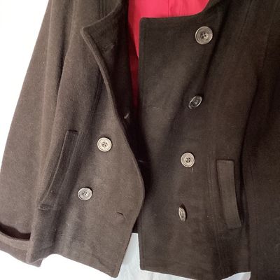 Sale Photo Thumbnail #494: Aeropostale black double-breasted hooded pea coat, women's size XL Features front button closure, side slip pockets, buttoned sleeve cuffs, rear button strap detail, and a bright pink inner. Length measures approximately 26 inches. In good pre-owned condi