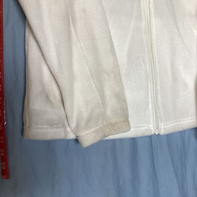 Sale Photo Thumbnail #458: White full-zip soft fleece jacket by Columbia Sportswear Company. Features a high collar, full front zipper, embroidered Columbia patch logo on the chest, and elastic cuffs. Tag size is XXL, made in Vietnam. Measures approximately 26 inches in length from