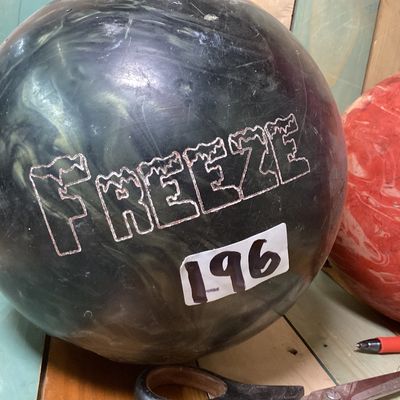 Sale Photo Thumbnail #535: Pair of drilled bowling balls. Includes:
1. Columbia 300 "Freeze" bowling ball in dark swirl finish, made in USA, 
2. Brunswick "Lethal Revolver" bowling ball in orange swirl finish, featuring USBC certification stamp GDC31053.

Condition: Used condition 