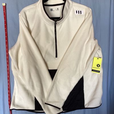 Sale Photo Thumbnail #427: New with tags Xersion quarter-zip fleece pullover in ivory with black trim and accent pocket. Features brushed interior fleece fabric, thumbholes, center zip pocket, and no-chafe seams. Size XXL.