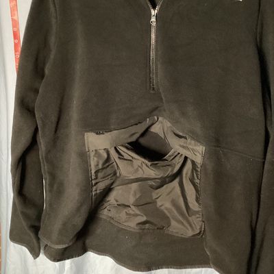 Sale Photo Thumbnail #383: A black fleece quarter-zip pullover jacket by Xersion. Features a front nylon-style kangaroo pocket with a top flap opening, long sleeves, and a mock neck collar. Size XXL. Gently used condition with minor lint/fuzz consistent with normal wear.