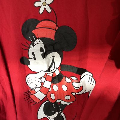 Sale Photo Thumbnail #461: Red crewneck Disney sweatshirt featuring a graphic print of Minnie Mouse in a scarf and skirt with a flower hat. Size tag states 1X. Made of a cotton blend. Shows light wear consistent with pre-owned condition, including some loose threads near the bottom