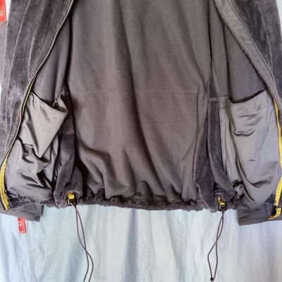 Sale Photo Thumbnail #410: L.L. Bean women's full-zip plush fleece jacket in dark gray / charcoal. Size 1X Regular. Made from 100% recycled polyester. Features a full front zipper, interior drawstring hem, and hand pockets. Length measures approximately 27-28 inches. In good pre-ow