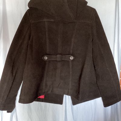 Sale Photo Thumbnail #498: Aeropostale black double-breasted hooded pea coat, women's size XL Features front button closure, side slip pockets, buttoned sleeve cuffs, rear button strap detail, and a bright pink inner. Length measures approximately 26 inches. In good pre-owned condi
