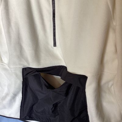 Sale Photo Thumbnail #431: New with tags Xersion quarter-zip fleece pullover in ivory with black trim and accent pocket. Features brushed interior fleece fabric, thumbholes, center zip pocket, and no-chafe seams. Size XXL.