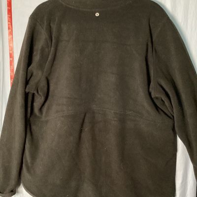 Sale Photo Thumbnail #382: A black fleece quarter-zip pullover jacket by Xersion. Features a front nylon-style kangaroo pocket with a top flap opening, long sleeves, and a mock neck collar. Size XXL. Gently used condition with minor lint/fuzz consistent with normal wear.