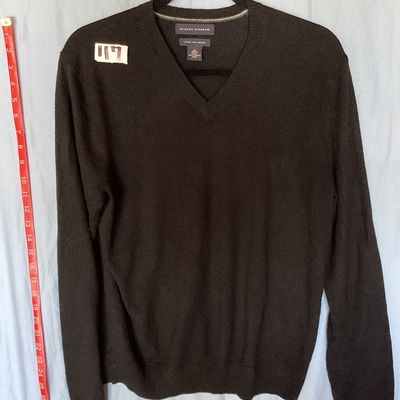 Sale Photo Thumbnail #397: Banana Republic men's long-sleeve V-neck sweater in dark brown/black. Made from 100% extra fine merino wool. Size Small. Features ribbed cuffs and hem. Measures approximately 26 inches in length from shoulder to hem. Good pre-owned condition with light si