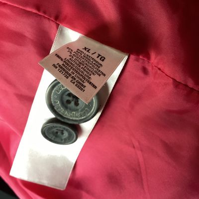 Sale Photo Thumbnail #499: Aeropostale black double-breasted hooded pea coat, women's size XL Features front button closure, side slip pockets, buttoned sleeve cuffs, rear button strap detail, and a bright pink inner. Length measures approximately 26 inches. In good pre-owned condi