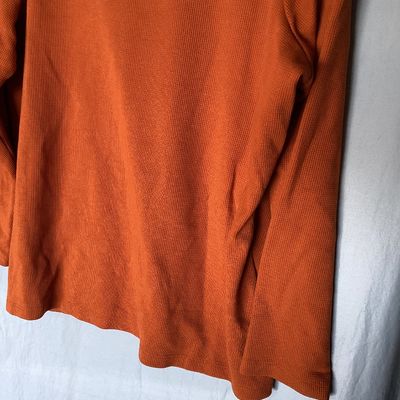 Sale Photo Thumbnail #473: Women's long sleeve cowl neck knit top by D&Co. Essentials in burnt orange. Features a waffle knit texture. Size US 1X  Made in Vietnam. Measures approximately 28 inches in length. In good condition with no visible tears or major stains.