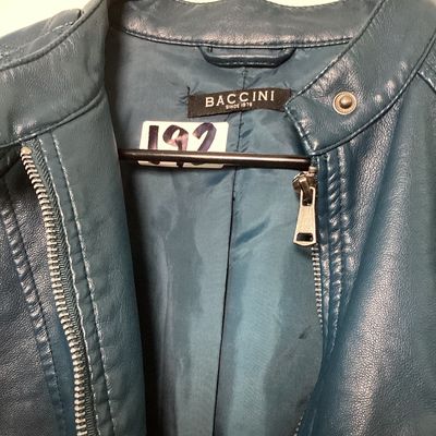 Sale Photo Thumbnail #508: Women's teal blue faux leather moto-style jacket by Baccini. Features a front zip closure, snap collar, quilted details on sleeves and shoulders, stretchy knit side panels, and zippered cuffs. Fully lined. Appears to be in good condition. Women’s medium