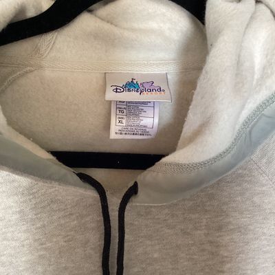 Sale Photo Thumbnail #446: Disneyland Resort hooded sweatshirt featuring an embroidered front design of Winnie the Pooh, Tigger, Piglet, and a snowman with 'Disneyland' embroidered below. Features front side-entry pockets, a fleece-lined hood with drawstring, and an adjustable draw
