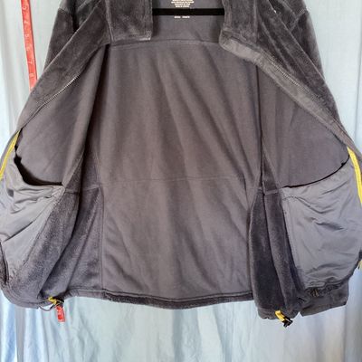 Sale Photo Thumbnail #409: L.L. Bean women's full-zip plush fleece jacket in dark gray / charcoal. Size 1X Regular. Made from 100% recycled polyester. Features a full front zipper, interior drawstring hem, and hand pockets. Length measures approximately 27-28 inches. In good pre-ow
