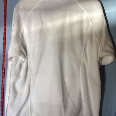 Sale Photo Thumbnail #459: White full-zip soft fleece jacket by Columbia Sportswear Company. Features a high collar, full front zipper, embroidered Columbia patch logo on the chest, and elastic cuffs. Tag size is XXL, made in Vietnam. Measures approximately 26 inches in length from