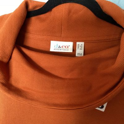 Sale Photo Thumbnail #471: Women's long sleeve cowl neck knit top by D&Co. Essentials in burnt orange. Features a waffle knit texture. Size US 1X  Made in Vietnam. Measures approximately 28 inches in length. In good condition with no visible tears or major stains.