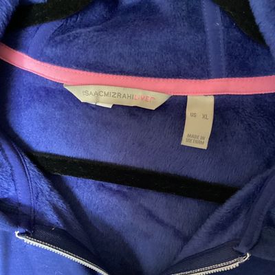 Sale Photo Thumbnail #437: Isaac Mizrahi Live! women's full-zip hooded jacket in royal blue. Features a soft plush fleece interior lining, front patch pockets, drawstring hood, and split hem. Size US XL. Made in Vietnam. Measures approximately 29 inches in length. In good pre-owned