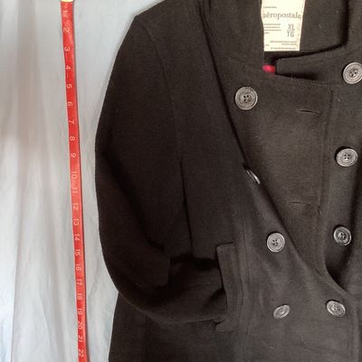 Sale Photo Thumbnail #500: Aeropostale black double-breasted hooded pea coat, women's size XL Features front button closure, side slip pockets, buttoned sleeve cuffs, rear button strap detail, and a bright pink inner. Length measures approximately 26 inches. In good pre-owned condi